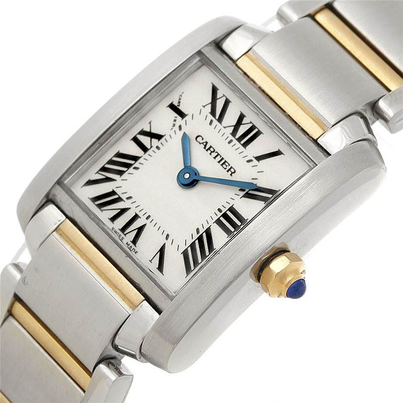 The image shows a close-up, tilted angle of the Cartier Tank Française watch, highlighting its face, crown, and part of the bracelet.
