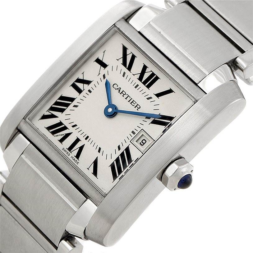 The image shows a close-up angled view of the Cartier Tank Française watch, highlighting the dial, crown, and part of the bracelet.