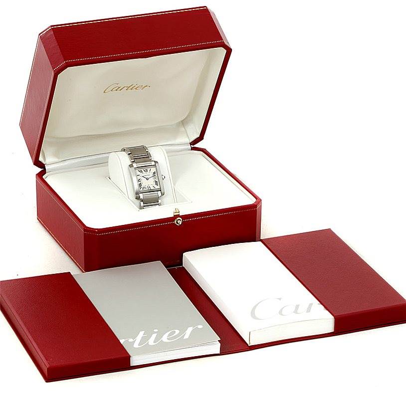 The Cartier Tank Francaise W51011Q3 Women's Stainless Steel Silver Dial W51011Q3 Women's Stainless Steel Silver Dial watch is shown in its open red box alongside documentation holders.