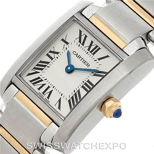 This Tank Française model by Cartier is shown at an angle focusing on the face, bezel, case, and part of the bracelet with a close-up of the crown.