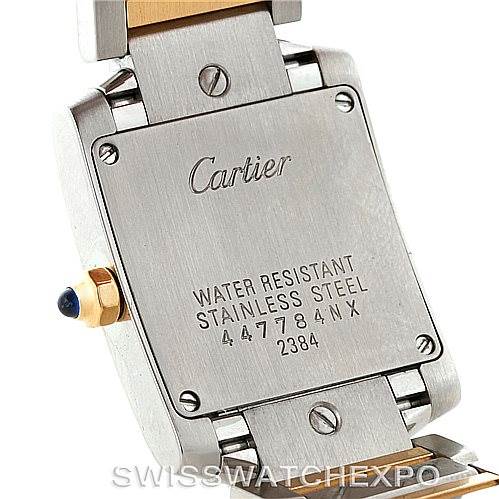 The image shows the backside of a Cartier Tank Française watch, including the case back, bracelet links, and some inscriptions.