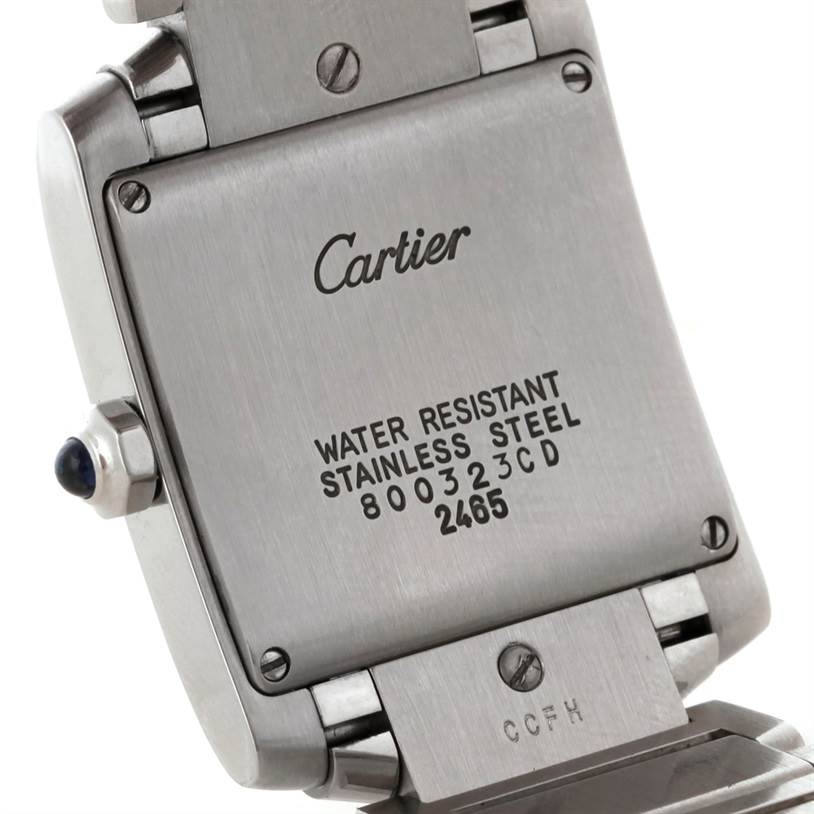 The image shows the back of a Cartier Tank Francaise W51011Q3 Women's Stainless Steel Silver Dial W51011Q3 Women's Stainless Steel Silver Dial watch, focusing on the stainless steel case with model and brand inscriptions.