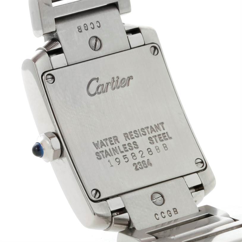 The image shows the back of the Cartier Tank Française watch, including part of the clasp and a visible gemstone on the crown.