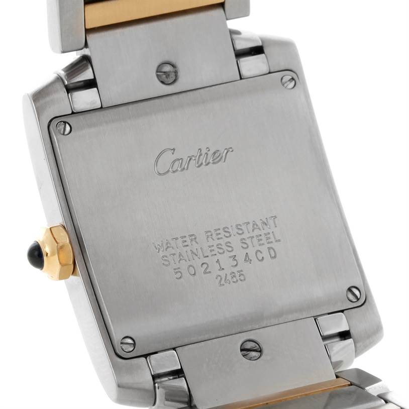 The image shows the back case and part of the bracelet of a Cartier Tank Francaise W51012Q4 Women's Steel and Gold (two tone) Silver Dial W51012Q4 Women's Steel and Gold (two tone) Silver Dial watch.