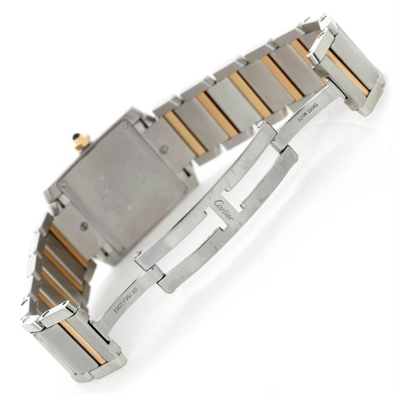 This image shows the clasp and the back of the Tank Française watch by Cartier at an angle, highlighting the metal bracelet and the deployment clasp.