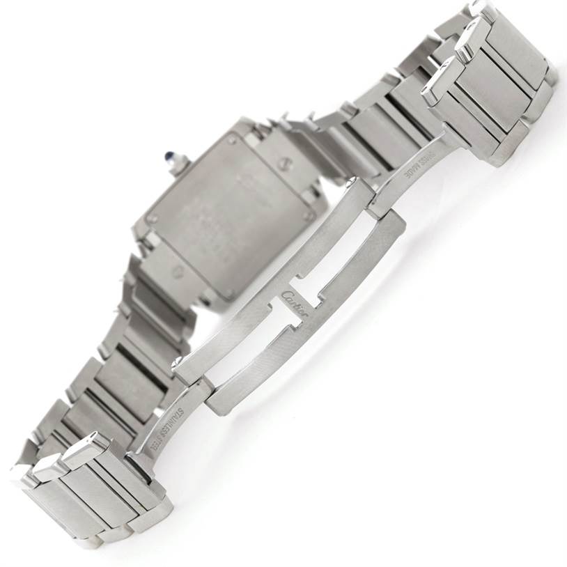 This image shows the clasp and backside of the stainless steel bracelet of a Cartier Tank Française watch.