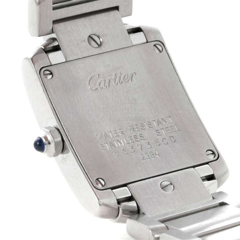 This image shows the stainless steel case back of the Cartier Tank Française watch, revealing the brand engraving and serial number.