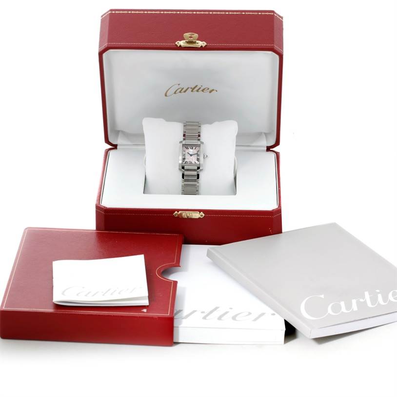 The Cartier Tank Francaise W51031Q3 Women's Stainless Steel Silver Dial W51031Q3 Women's Stainless Steel Silver Dial watch is displayed in its open box with papers and additional packaging shown in front.