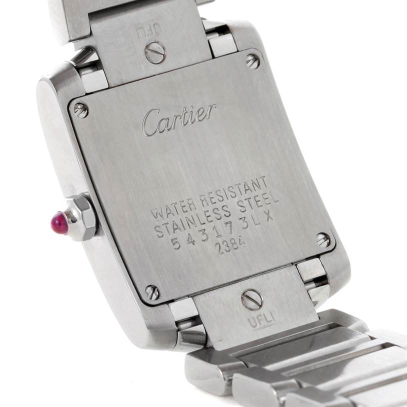 The image shows the back case and part of the bracelet of a Cartier Tank Francaise W51031Q3 Women's Stainless Steel Silver Dial W51031Q3 Women's Stainless Steel Silver Dial watch, focusing on the engraved details and crown.