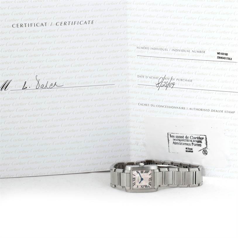 The image shows a Tank Francaise watch by Cartier from an angled view, alongside its certificate of authenticity.
