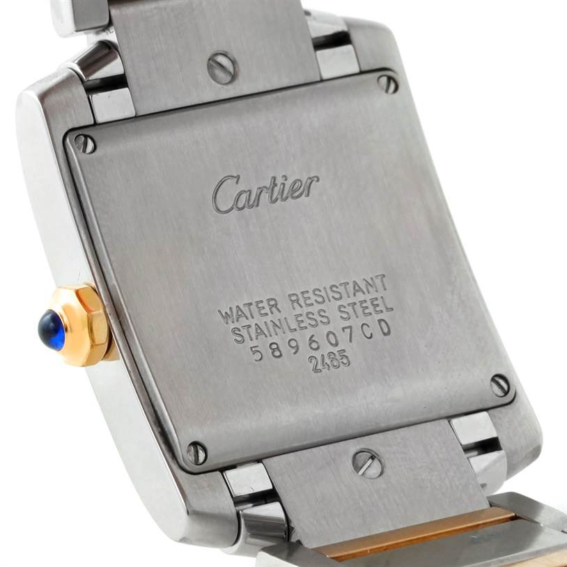 The image shows the back case and crown of a Cartier Tank Francaise W51012Q4 Women's Steel and Gold (two tone) Silver Dial W51012Q4 Women's Steel and Gold (two tone) Silver Dial watch in a close-up angle.