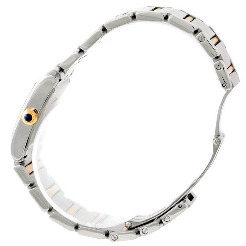 The image shows a side profile of the Cartier Tank Française watch, focusing on its metal bracelet and crown.