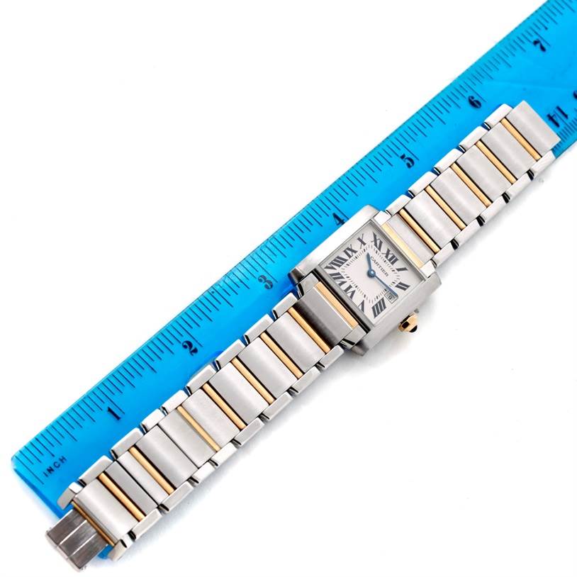 This image shows a top-down view of a Cartier Tank Francaise W51012Q4 Women's Steel and Gold (two tone) Silver Dial W51012Q4 Women's Steel and Gold (two tone) Silver Dial watch with a ruler for scale.