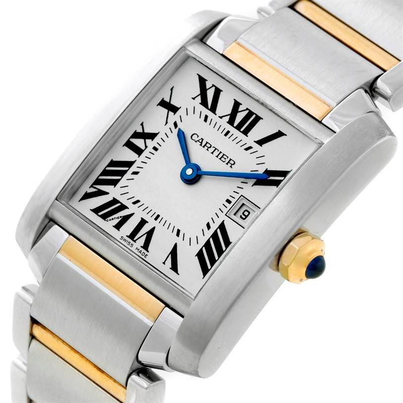 This is a close-up image displaying the face, crown, and part of the bracelet of the Cartier Tank Française watch.