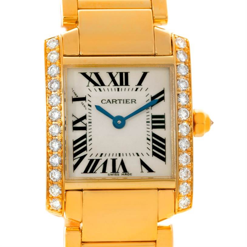 The Cartier Tank Française watch is shown from a front angle, displaying its rectangular face, Roman numerals, blue hands, and diamond accents.
