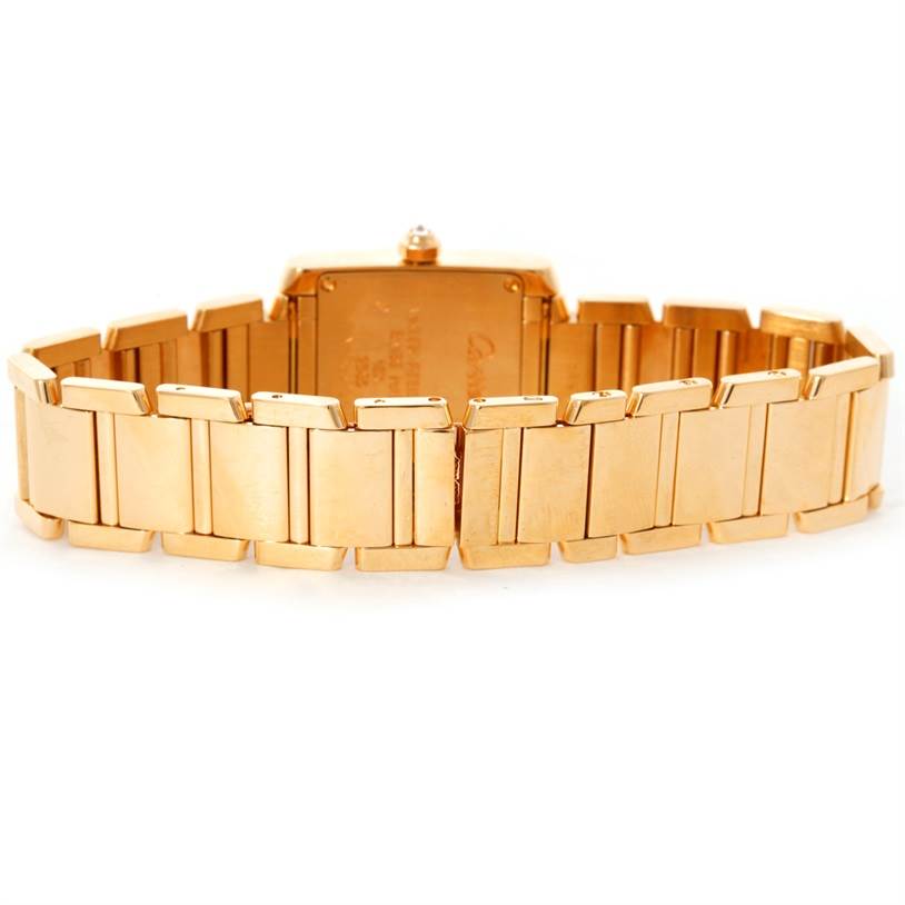 The image shows the rear view of a Cartier Tank Francaise WE1001R8 Women's Yellow Gold Silver Dial WE1001R8 Women's Yellow Gold Silver Dial watch, highlighting its gold bracelet and clasp.