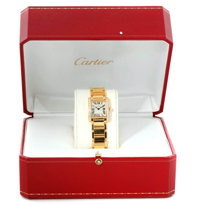 The Cartier Tank Francaise WE1001R8 Women's Yellow Gold Silver Dial WE1001R8 Women's Yellow Gold Silver Dial watch is shown from the front, in a red Cartier box.