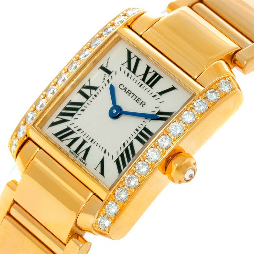The Cartier Tank Francaise WE1001R8 Women's Yellow Gold Silver Dial WE1001R8 Women's Yellow Gold Silver Dial watch is shown from a top angle, highlighting the diamond-set bezel, Roman numeral dial, and gold bracelet.