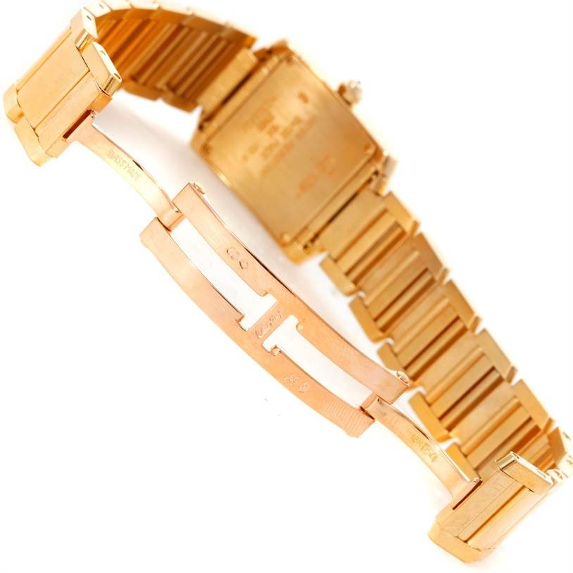 The image shows the back and clasp of a Cartier Tank Francaise WE1001R8 Women's Yellow Gold Silver Dial WE1001R8 Women's Yellow Gold Silver Dial watch at an angle.