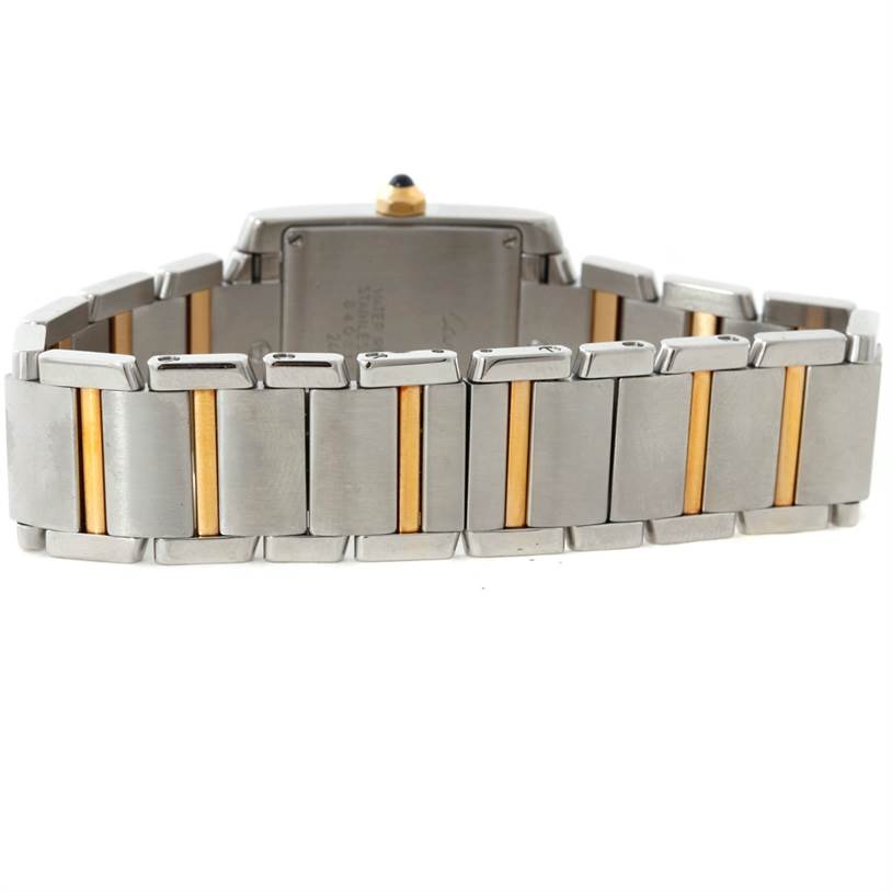 The image shows the bracelet and back case of a Cartier Tank Française watch, featuring steel and gold links.