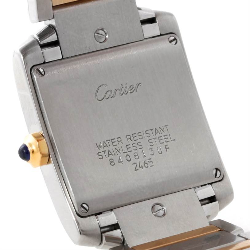 The image shows the back case of the Tank Francaise watch by Cartier, displaying the brand's engraving and model specifications.