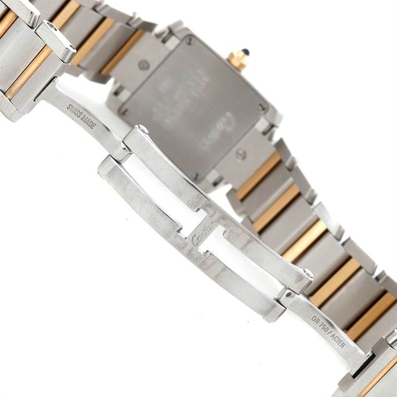 The image shows the back case and the bracelet clasp of a Cartier Tank Francaise W51007Q4 Women's Steel and Gold (two tone) Silver Dial W51007Q4 Women's Steel and Gold (two tone) Silver Dial watch, including the two-tone metal links.