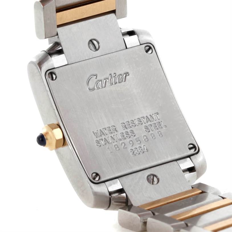 This image shows the backcase of the Cartier Tank Française watch, highlighting the serial number and branding details.
