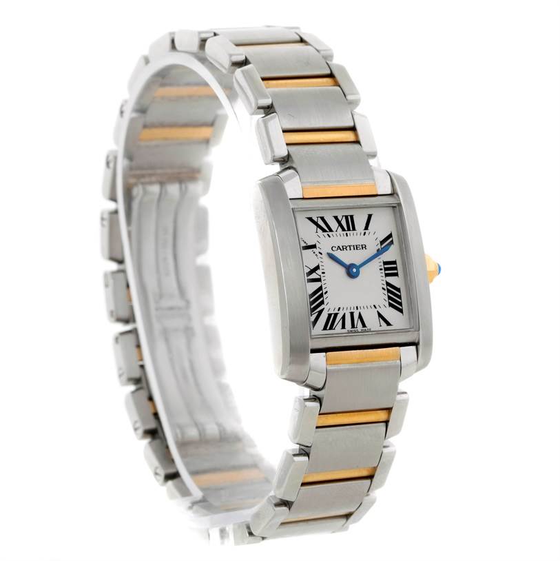 The Cartier Tank Française watch is displayed at an angle showing its rectangular face and metal bracelet with gold accents.