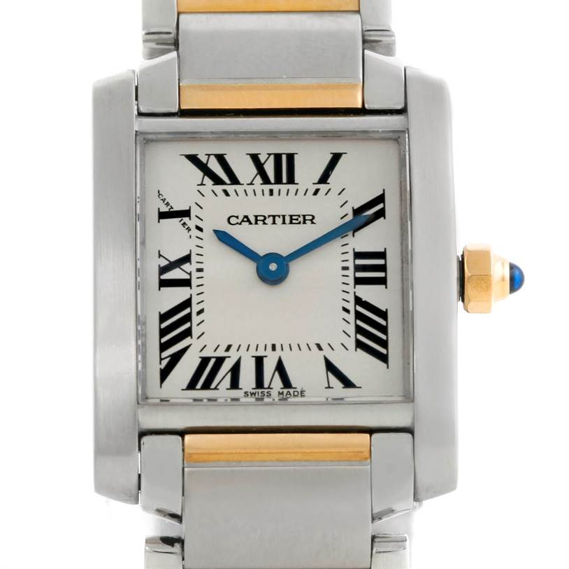This image shows a frontal view of a Cartier Tank Francaise W51007Q4 Women's Steel and Gold (two tone) Silver Dial W51007Q4 Women's Steel and Gold (two tone) Silver Dial watch, highlighting its face, metal bracelet, and crown with a blue gem.