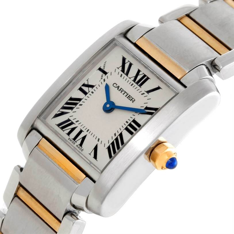 The image shows a close-up angled view of the Cartier Tank Française watch, highlighting the dial, crown, and bracelet.