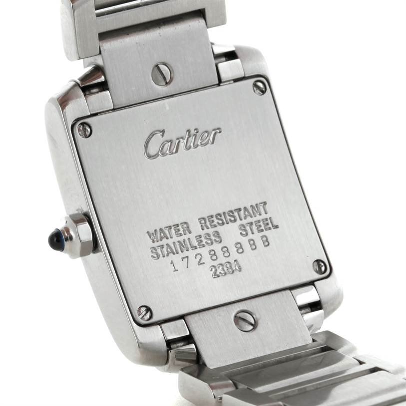 This image shows the back case and part of the bracelet of the Cartier Tank Francaise W51008Q3 Women's Stainless Steel Silver Dial W51008Q3 Women's Stainless Steel Silver Dial watch, displaying brand, material, and serial numbers.