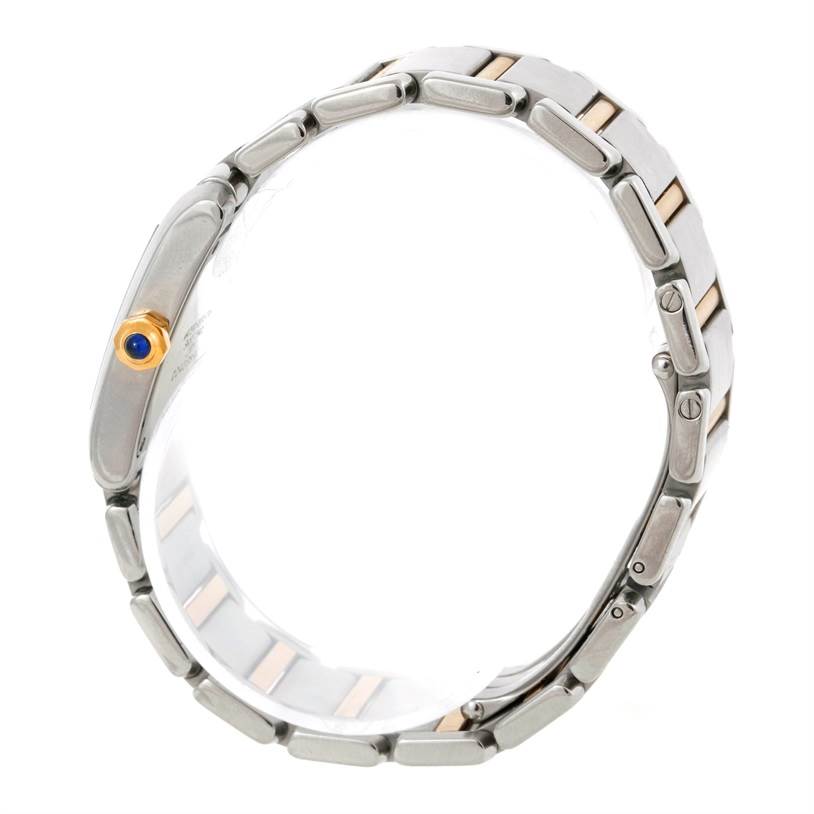 This image shows the side view of the bracelet and crown of a Cartier Tank Francaise W51006Q4 Women's Steel and Gold (two tone) Silver Dial W51006Q4 Women's Steel and Gold (two tone) Silver Dial watch.