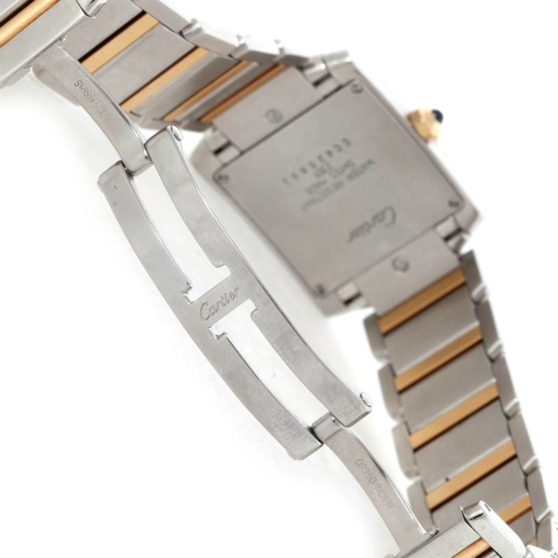 The image shows the back case and clasp of a Cartier Tank Francaise W51006Q4 Women's Steel and Gold (two tone) Silver Dial W51006Q4 Women's Steel and Gold (two tone) Silver Dial watch, focusing on the stainless steel bracelet and deployment clasp.