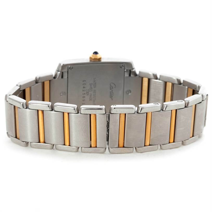 The image shows the back view of a Cartier Tank Française watch, highlighting the two-tone metal bracelet and case back.