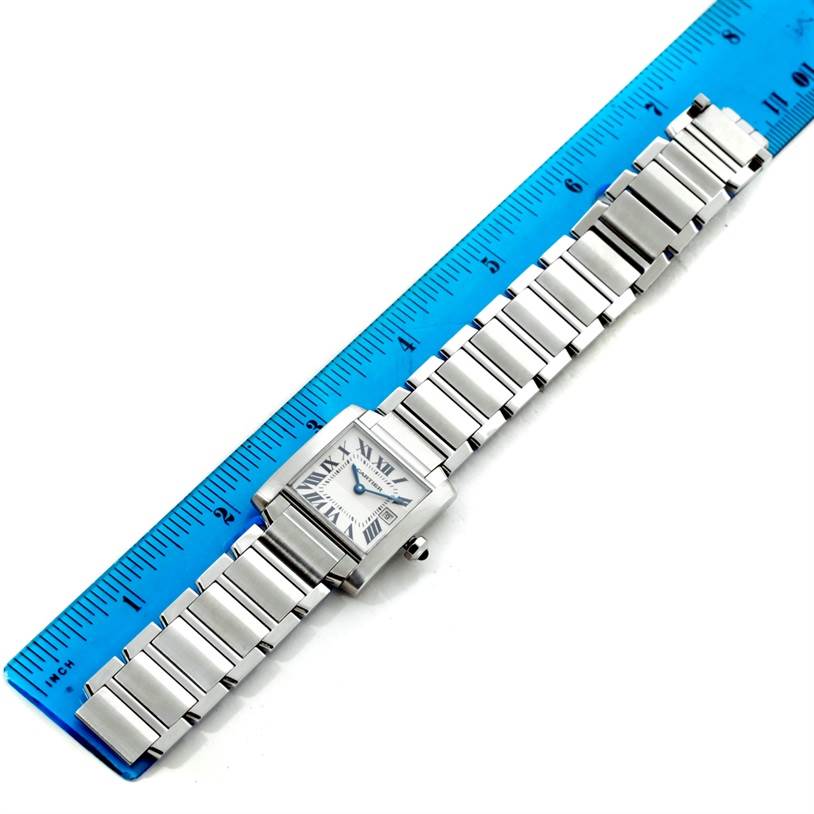 The Cartier Tank Francaise W51011Q3 Women's Stainless Steel Silver Dial W51011Q3 Women's Stainless Steel Silver Dial watch is shown from a top-down angle alongside a blue ruler for scale.