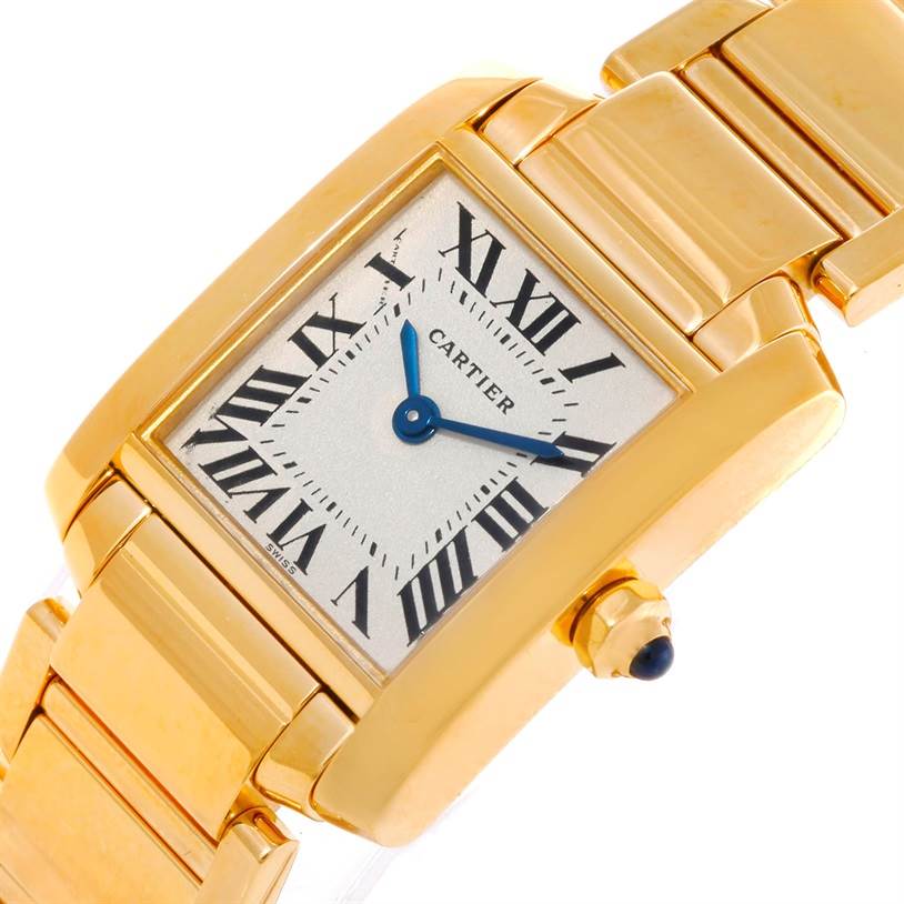 This image shows a close-up angled view of a Cartier Tank Française watch, highlighting the rectangular dial, Roman numerals, blue hands, and gold bracelet.