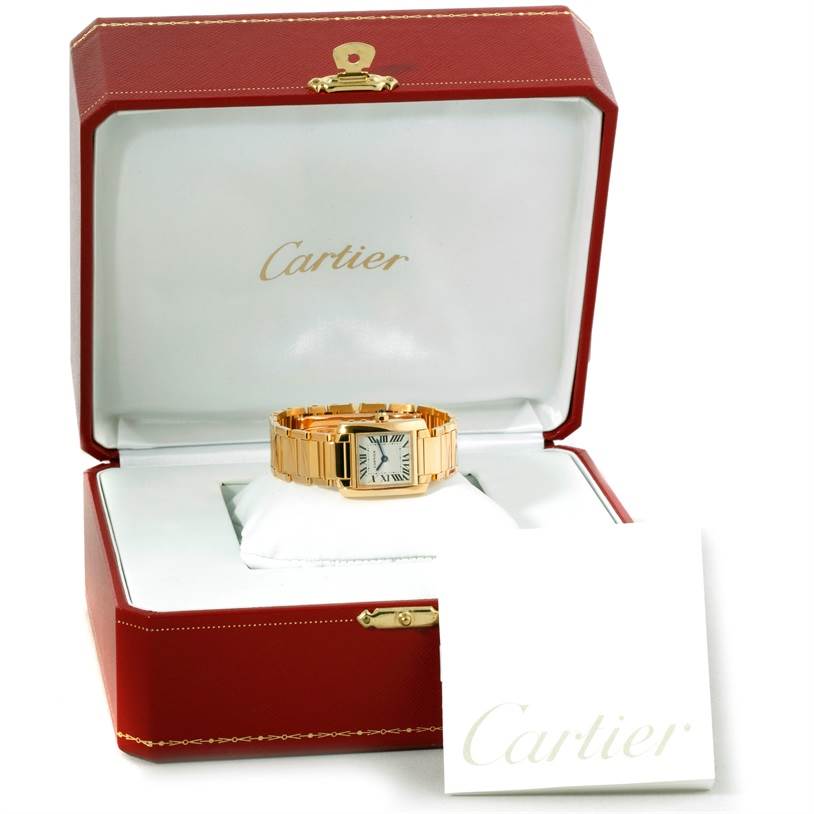 The Cartier Tank Francaise W50002N2 Women's Yellow Gold Silver Dial W50002N2 Women's Yellow Gold Silver Dial watch is displayed in an open red Cartier box with a white card next to it.