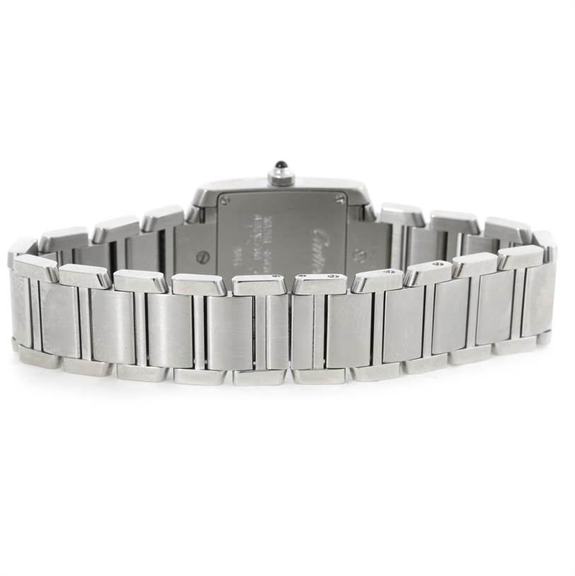 The image shows the back view of a Cartier Tank Francaise W51008Q3 Women's Stainless Steel Silver Dial W51008Q3 Women's Stainless Steel Silver Dial watch, including its stainless steel bracelet and case back.