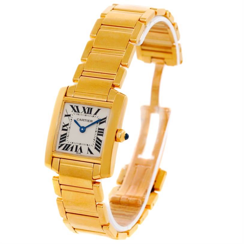 The Cartier Tank Française watch is shown at an angle highlighting its gold rectangular case, Roman numeral dial, and gold linked bracelet.