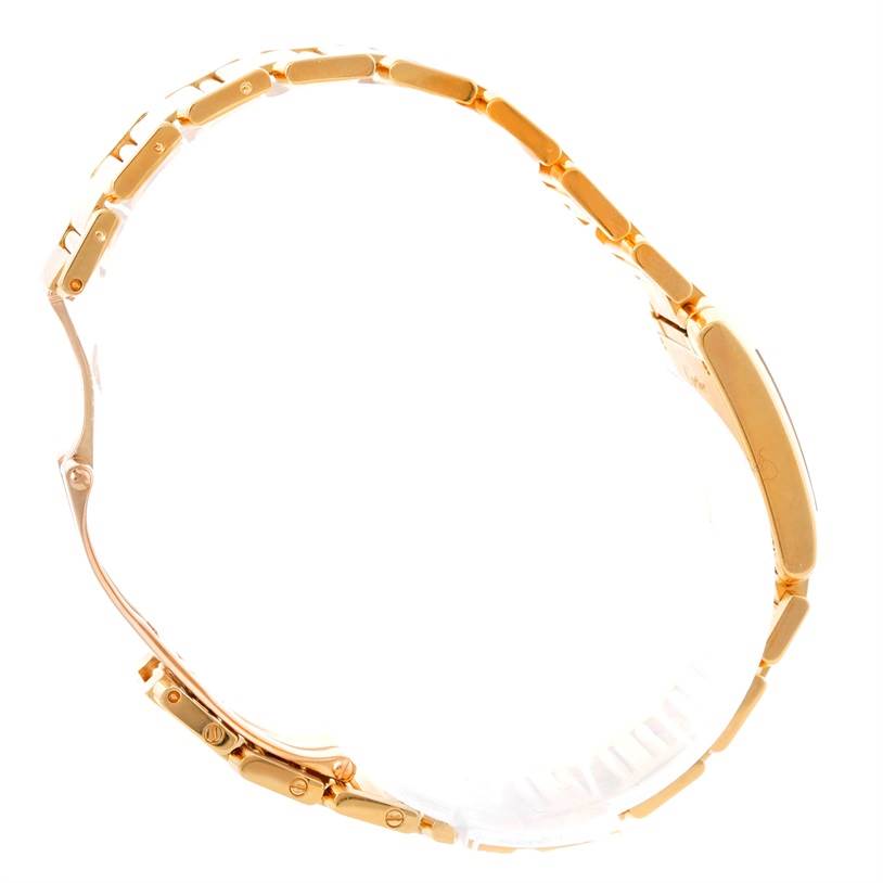 The image shows the side profile of a Cartier Tank Francaise W50002N2 Women's Yellow Gold Silver Dial W50002N2 Women's Yellow Gold Silver Dial watch focusing on its gold bracelet and deployment clasp.