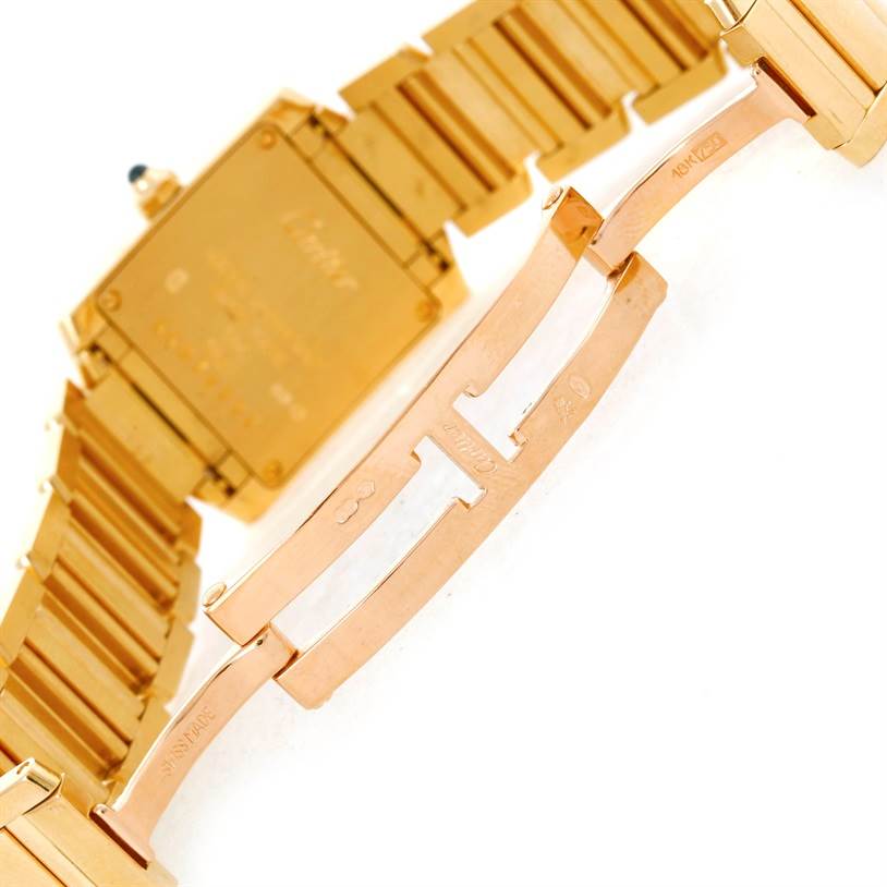 The image shows the back and clasp of a Cartier Tank Francaise W50002N2 Women's Yellow Gold Silver Dial W50002N2 Women's Yellow Gold Silver Dial watch, highlighting the gold bracelet and closing mechanism.