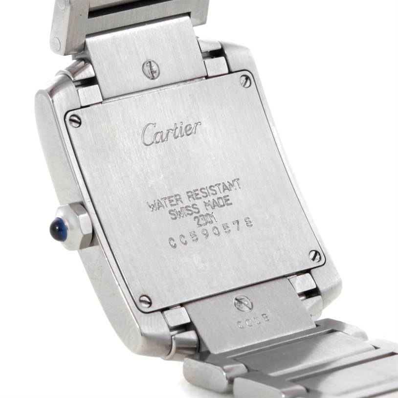 The image shows the back of a Cartier Tank Française watch, highlighting its caseback details and part of its bracelet.