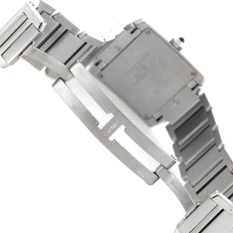 The image shows the back and bracelet of a Cartier Tank Française watch, highlighting the clasp and case back.