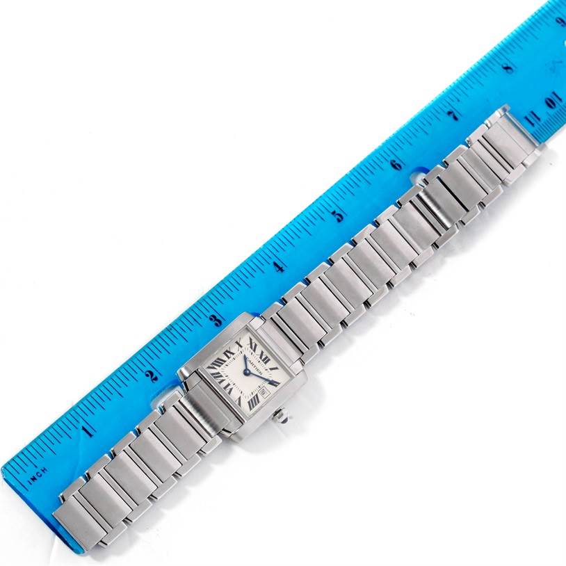 The image shows a Cartier Tank Francaise W51011Q3 Women's Stainless Steel Silver Dial W51011Q3 Women's Stainless Steel Silver Dial watch from an overhead angle, with a ruler placed alongside it for size reference.