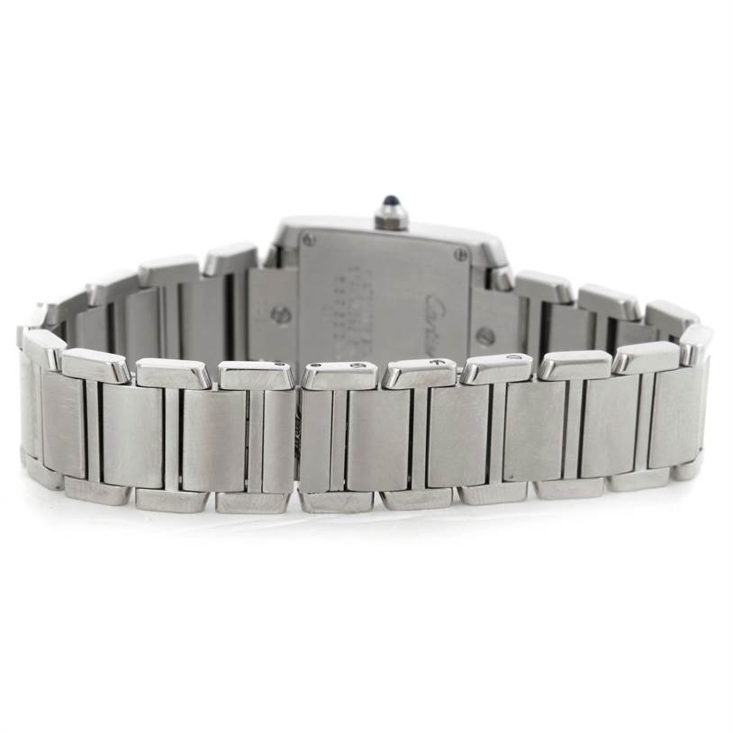This image shows the back view of a Tank Française watch by Cartier, focusing on its metal bracelet and clasp.