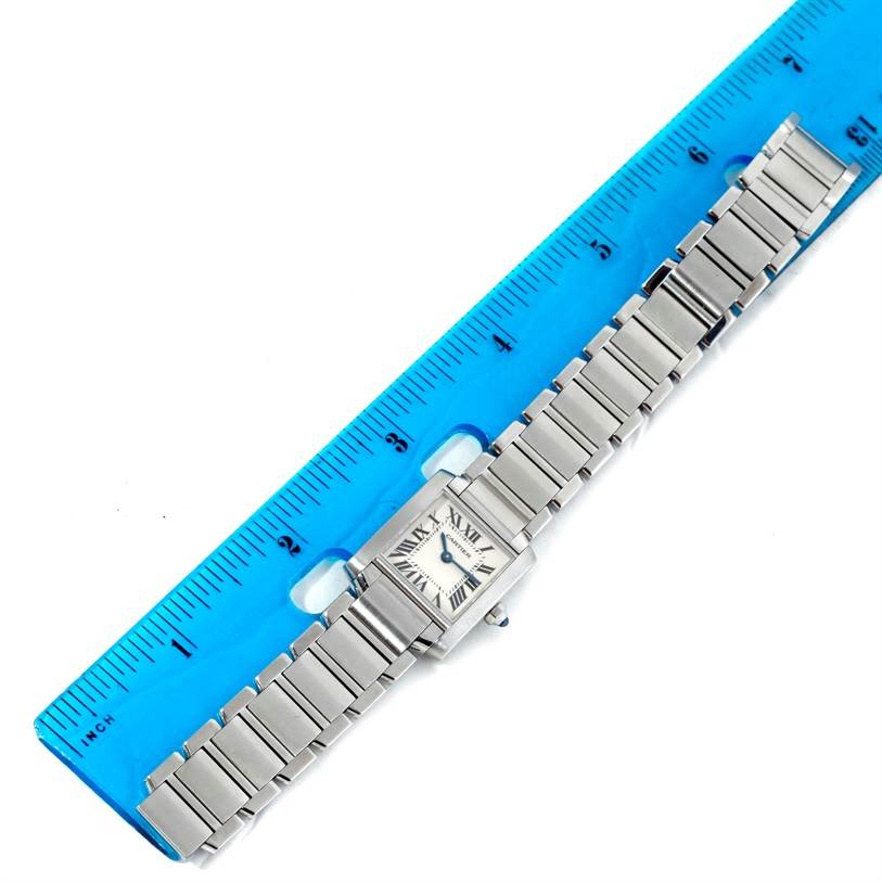 The Cartier Tank Francaise W51008Q3 Women's Stainless Steel Silver Dial W51008Q3 Women's Stainless Steel Silver Dial watch is shown from above, with the full bracelet and face visible next to a blue ruler for scale.