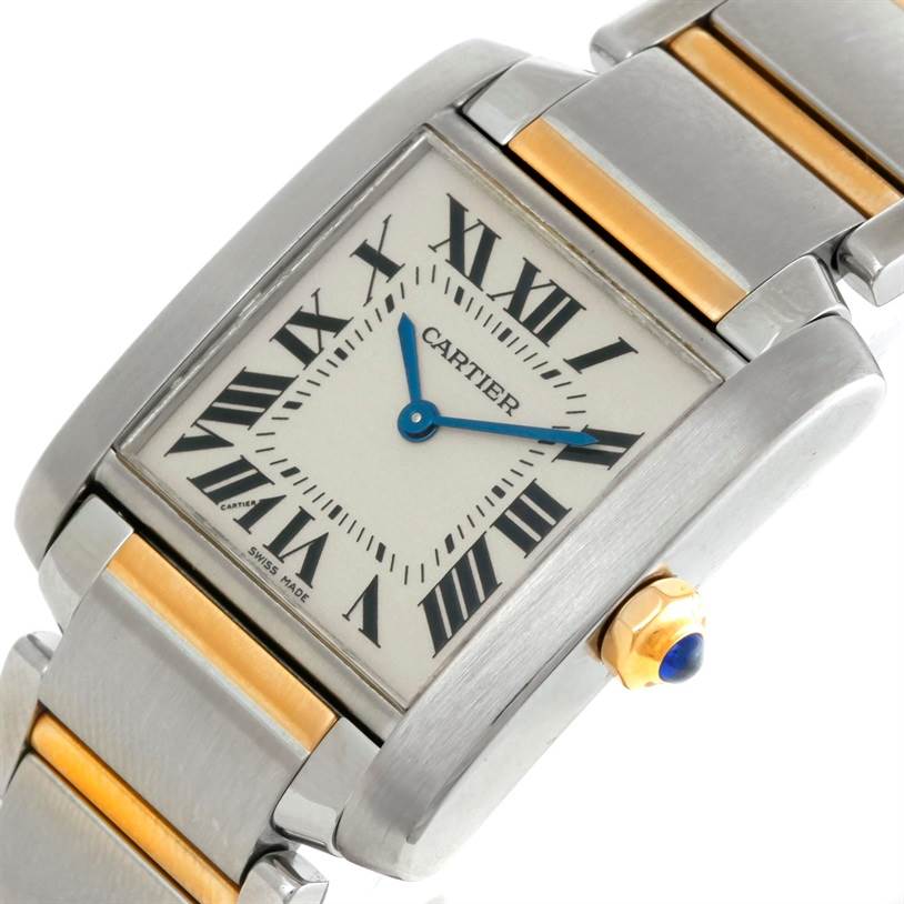The image shows a close-up of a Cartier Tank Française watch displaying its face, crown, and part of the bracelet.