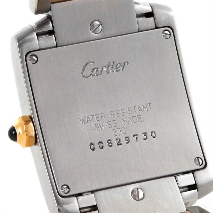 The image shows the back case and part of the bracelet of a Cartier Tank Francaise W51012Q4 Women's Steel and Gold (two tone) Silver Dial W51012Q4 Women's Steel and Gold (two tone) Silver Dial watch.