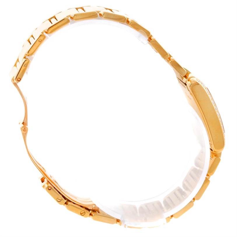 The Cartier Tank Française watch is shown from a side angle, emphasizing the bracelet and case profile.