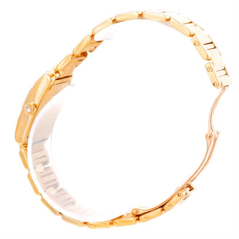 This image shows a profile view of the Cartier Tank Francaise WE1001R8 Women's Yellow Gold Silver Dial WE1001R8 Women's Yellow Gold Silver Dial watch focusing on its gold bracelet and side of the case.